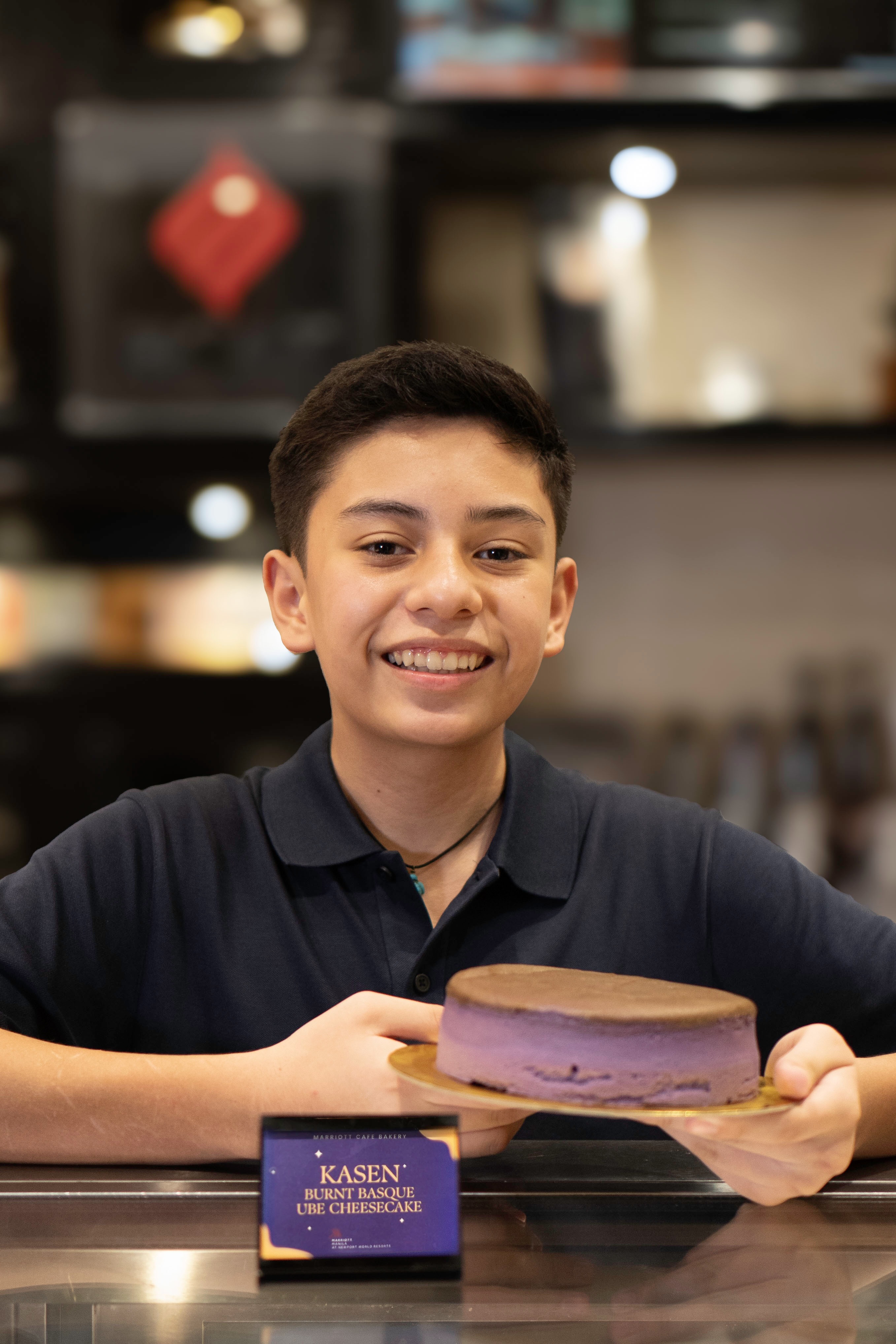 Kasen Abelgas with the Kasen Burnt Basque Ube Cheesecake at the Marriott Café Bakery, Manila Marriott Hotel at Newport World Resorts