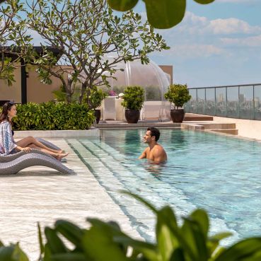 Man and woman in a swimming pool in Manila Marriott Hotel