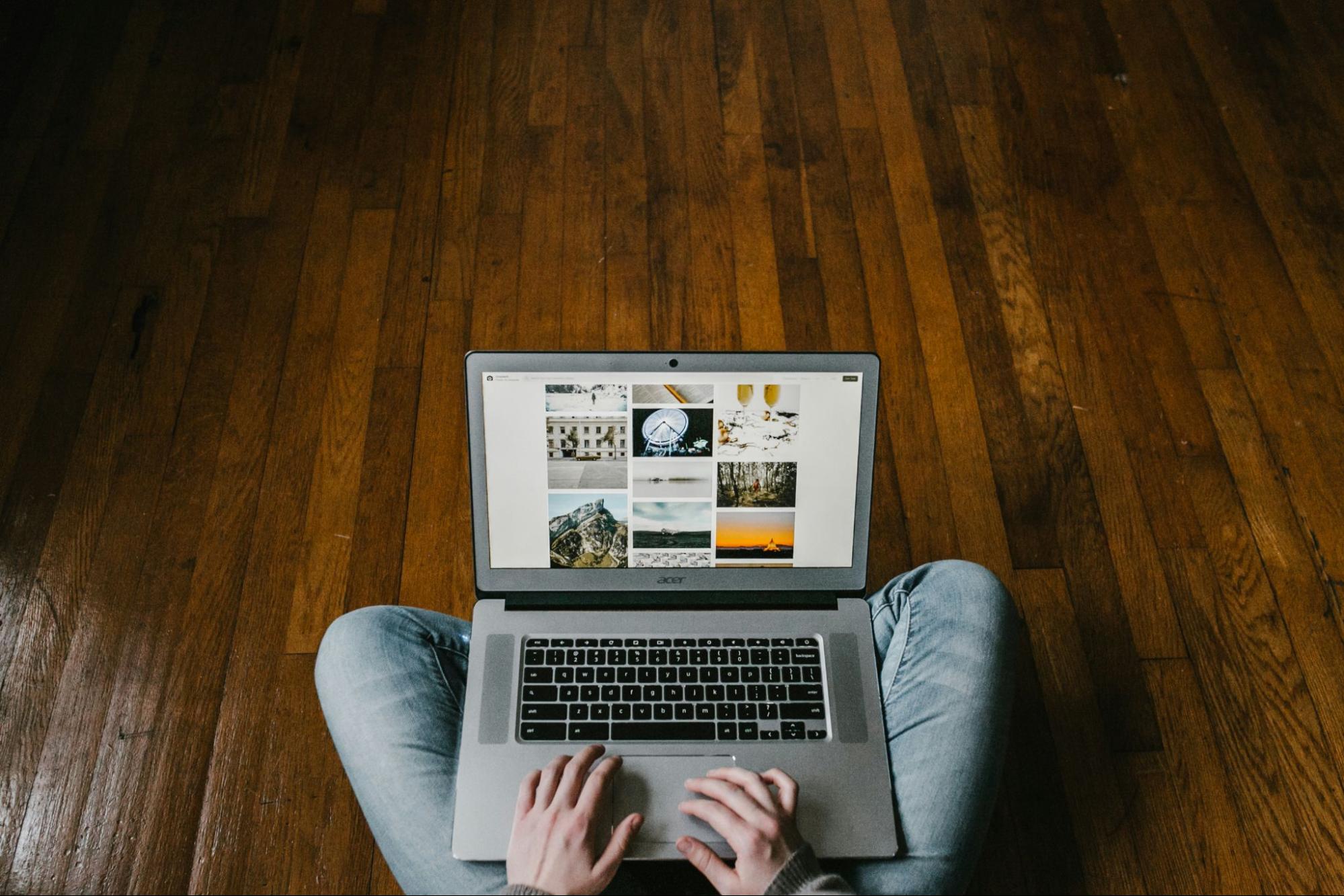 A person browsing the web using a laptop