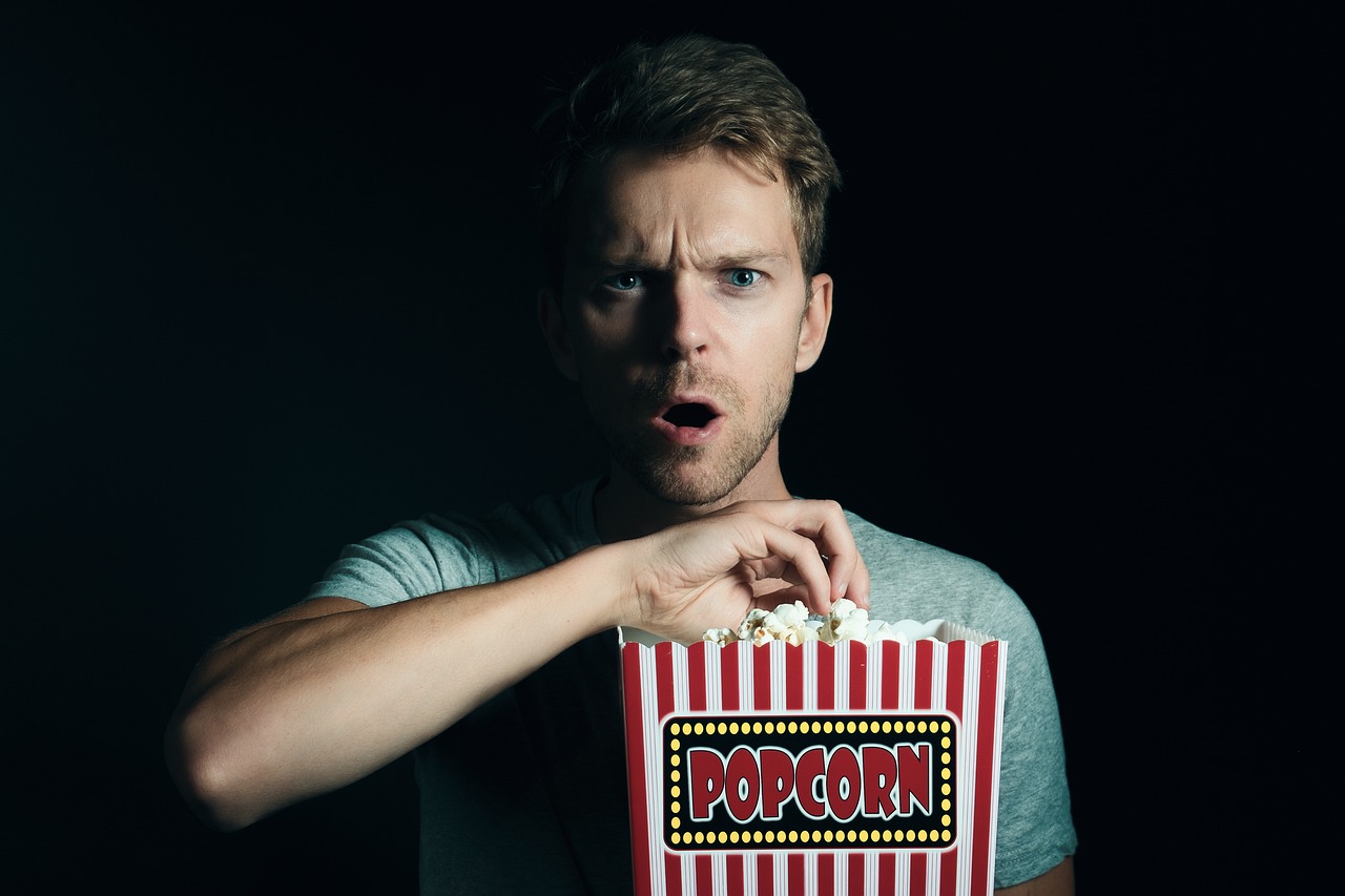 A man holding popcorn